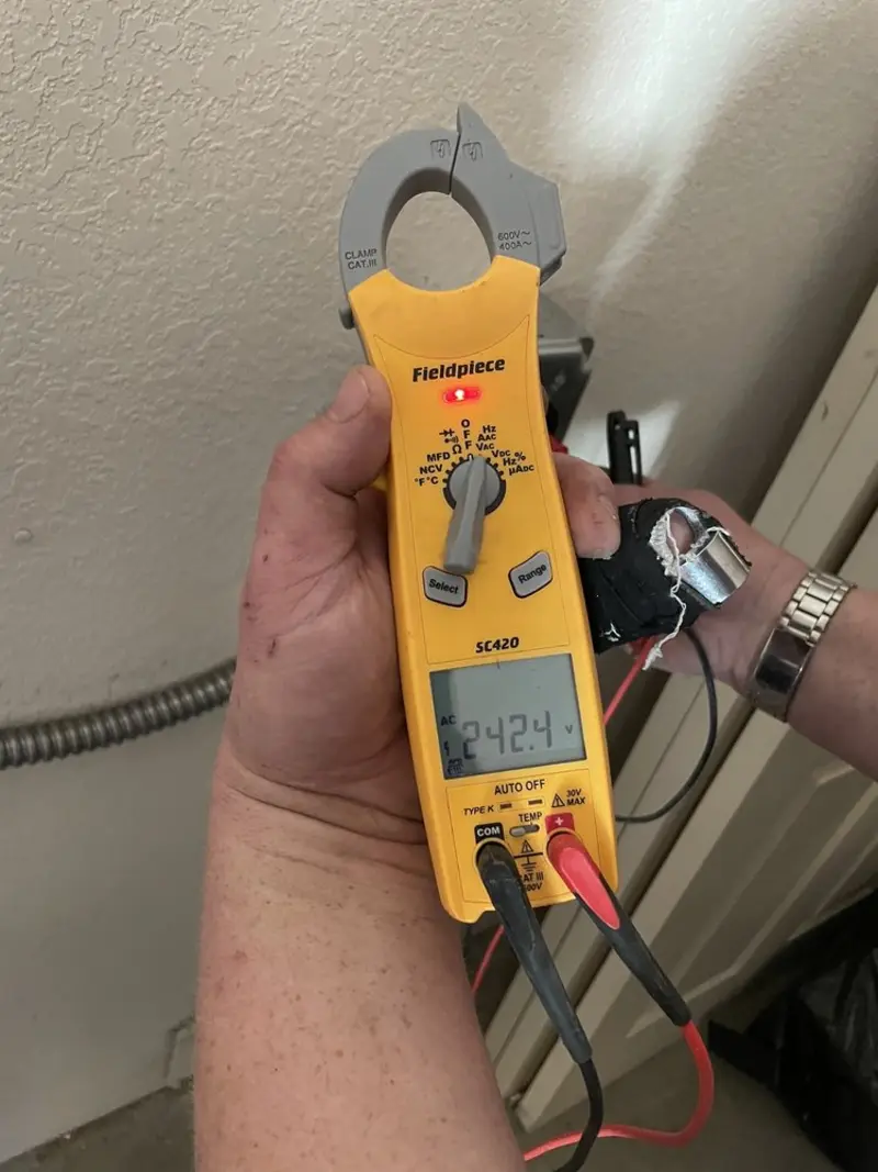 Voltage testing with clamp meter during Generator Installation in Foothill Farms